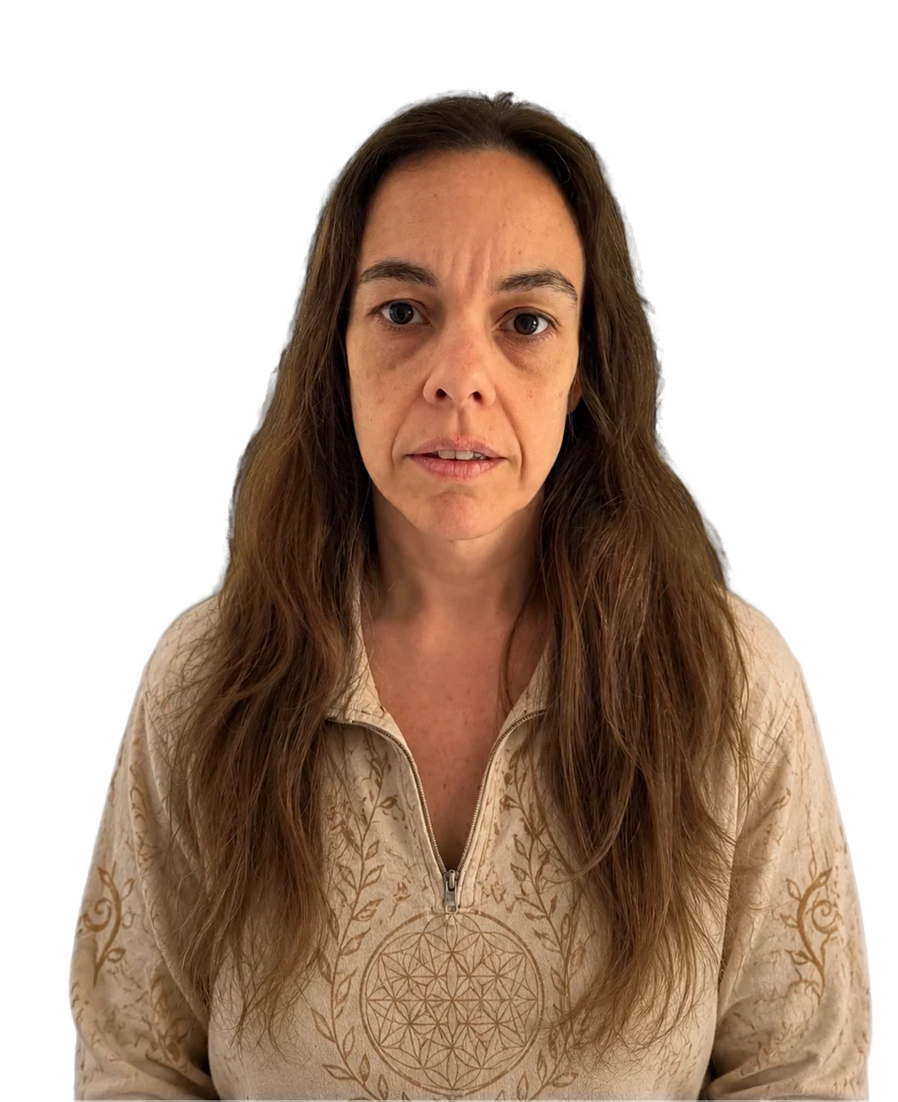 Fernanda, energy healer, in a cream top with a flower-of-life pattern